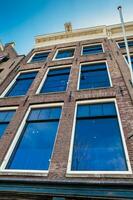 Facade of the Anne Frank house located at the Old Central district in Amsterdam photo