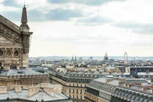 The beautiful Paris City seen from a rooftop in a cold winter day photo