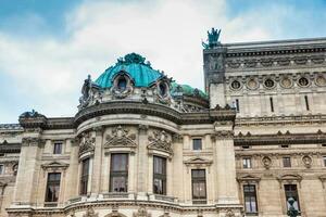 Detail of the historical building of the National academy of the music also called Opera Garnier in a cold winter day in Paris France photo