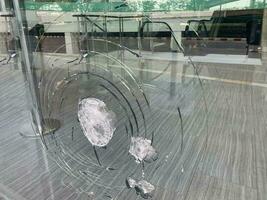 The glass was scratched from such a strong impact that it almost shattered, cracked glass photo