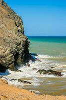 Waves breaking on the rocks at Cabo de la Vela in La Guajira in Colombia photo