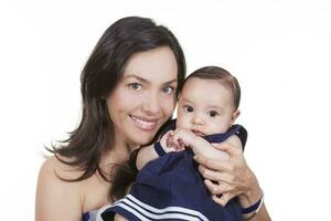 Mother and her baby girl looking at the camera photo