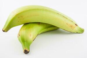Plantain or Green Banana isolated in white background. Musa x paradisiaca photo