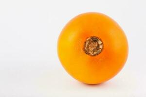 Exotic tropical fruit called lulo isolated on white background. Solanum quitoense photo