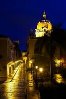 Night view of San Juan de Dios Street in the walled city of Cartagena de Indias in Colombia photo