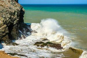 Waves breaking on the rocks at Cabo de la Vela in La Guajira in Colombia photo