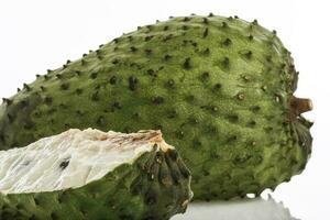 Tropical fruit called soursop isolated on white background. Annona muricata photo