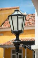Antique street lantern at the beautiful colonial streets of Cartagena de Indias in Colombia photo