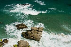 Clear waters and beautiful rocks at the National Natural Park Tayrona in Colombia photo