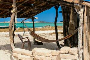 Traditional hammock beside the beach at Cabo de la Vela in La Guajira in Colombia photo