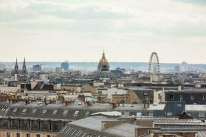 The beautiful Paris City seen from a rooftop in a cold winter day photo