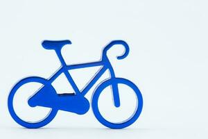 Blue toy bicycle isolated on white background. Cycling concept. Design element. photo