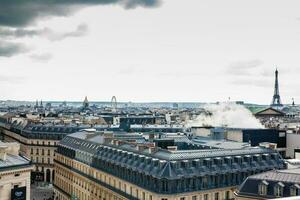 The beautiful Paris City seen from a rooftop in a cold winter day photo