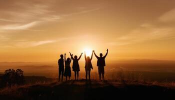 Silhouettes standing on mountain peak, arms raised together generated by AI photo