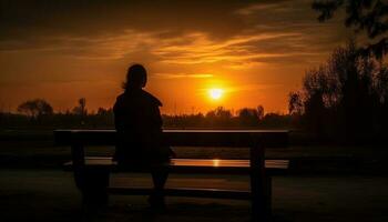 silueta de Pareja sentado en banco, acecho puesta de sol generado por ai foto