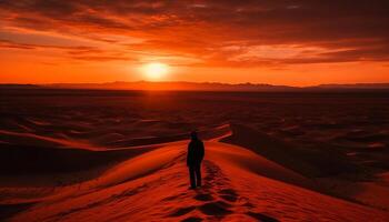 Silhouette walking on sand dune at sunset generated by AI photo