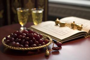 Table setting with a bunch of grapes and an open book. photo