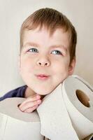 portrait of a little boy hugging a toilet paper photo