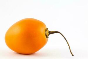 Exotic tropical fruit called tree tomato isolated on white background. Solanum Betaceum photo