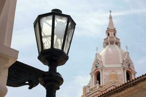 Street lantern and the Metropolitan Cathedral Basilica of Saint Catherine of Alexandria in Cartagena de Indias photo