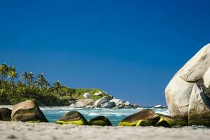 Tropical paradise beach with clear waters, white sand and beautiful rocks. National Natural Park Tayrona in Colombia photo