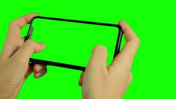 Phone green screen, green screen of hand holding and using phone, smartphone green screen, touch screen smartphone, chroma key phone video