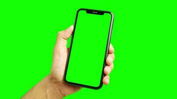telefoon groen scherm, groen scherm van hand- Holding en gebruik makend van telefoon, smartphone groen scherm, tintje scherm smartphone, chroma sleutel telefoon video