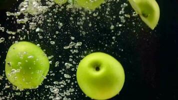 Slow motion, Apple fruit, sliced apples in water, slow motion of green apple in water video