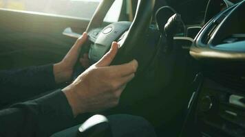 Man driving in innovative automated car using self-parking autopilot for parking on parking lot video