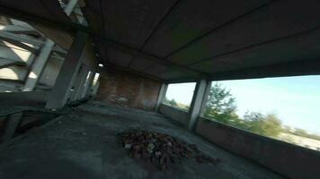 FPV drone flies fast through an abandoned building. Post-apocalyptic location without people video