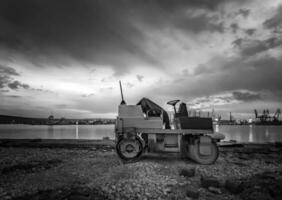 Beautiful black and white view at small roller at a construction site in a beautiful twilight photo