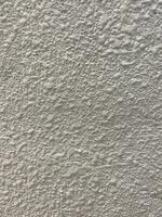 Textured cement wall paper background photo