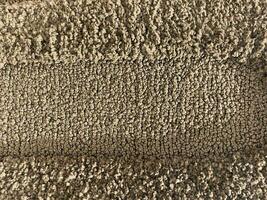 ligero marrón alfombra antecedentes textura foto