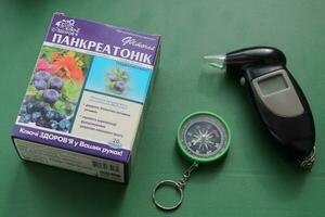 KYIV, UKRAINE - May 23, 2023 Drugs for alcoholism with a breathalyzer photo