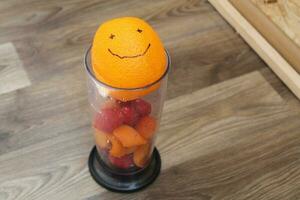 Fresh fruit juice in a blender photo