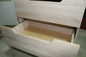 Assembling dresser furniture for storing clothes photo