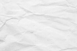 Abstract white crumpled and creased recycle paper texture background photo