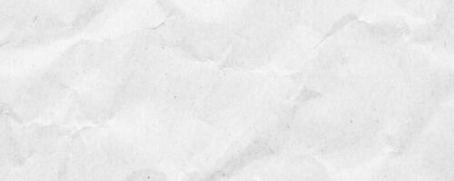 Abstract white crumpled and creased recycle paper texture background photo