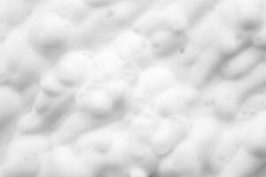 Abstract white soap foam bubbles texture background photo