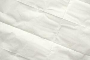 White folded and wrinkled paper texture background photo