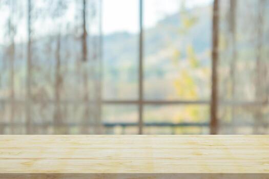 Empty wood table top with window curtain abstract blur background for product display photo