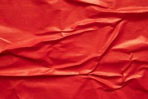 Blank red crumpled and creased paper poster texture background photo