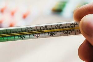 Temperature 38 on a mercury thermometer - fever in case of illness - viral epidemic photo