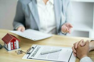 Business people signing contract making deal with real estate photo