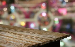 Empty wooden table in front of abstract blurred background of coffee shop . can be used for display or montage your products.Mock up for display of product photo