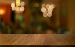 Empty wooden table in front of abstract blurred background of coffee shop . can be used for display or montage your products.Mock up for display of product photo