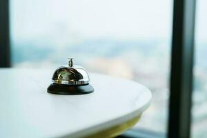 Hotel reception counter desk with service bell. photo