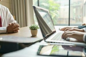 Examiner reading a resume during job interview at office Business and human resources concept photo