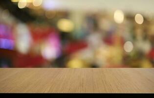 Empty wooden table in front of abstract blurred background of coffee shop . can be used for display or montage your products.Mock up for display of product photo