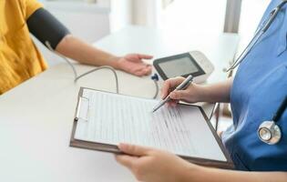 Doctor checking  patient arterial blood pressure. Health care. photo